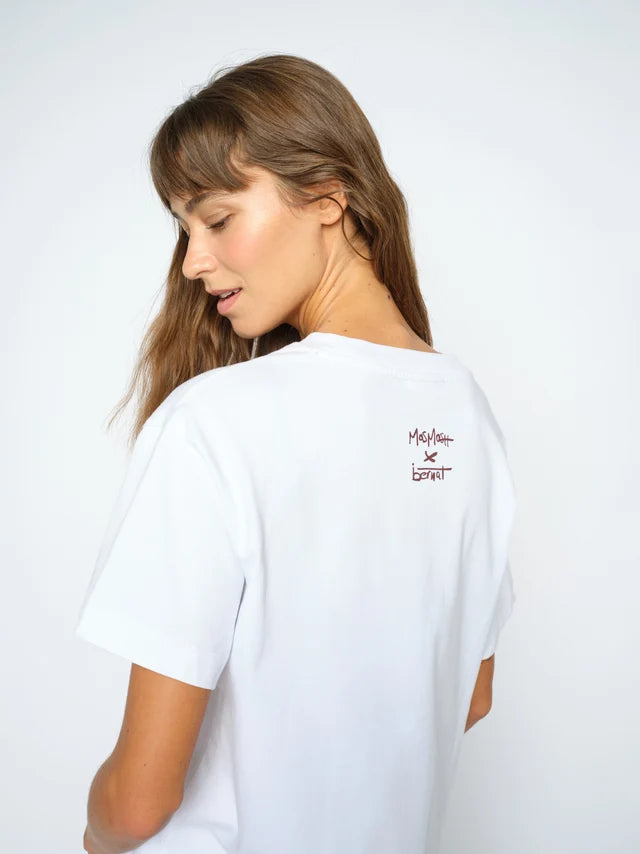 A woman wearing a white short-sleeve t-shirt, shown from the back. The shirt features a small red and black 'Melnior SPORT' logo printed on the upper right back.
