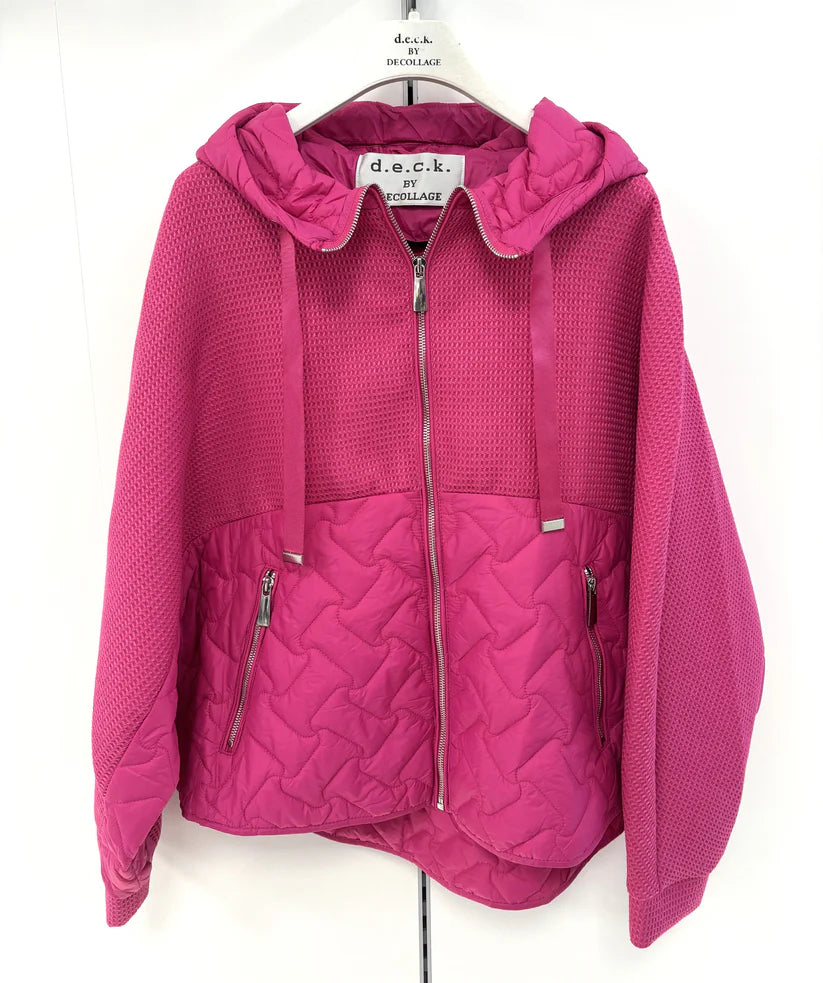 Pink quilted jacket on a hanger with a white background