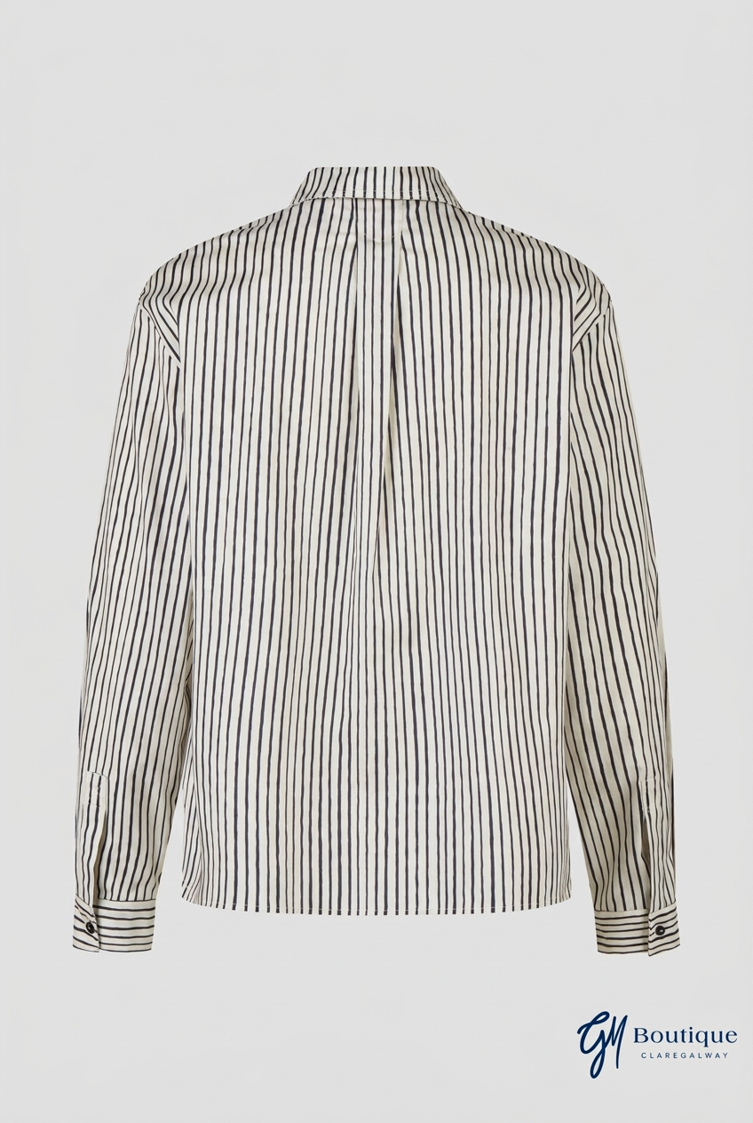 A long-sleeve button-up shirt with vertical black stripes on a white or off-white base, shown from the back against a light gray background.