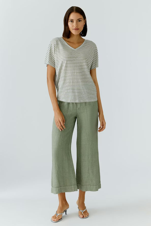 Woman wearing trousers on white background