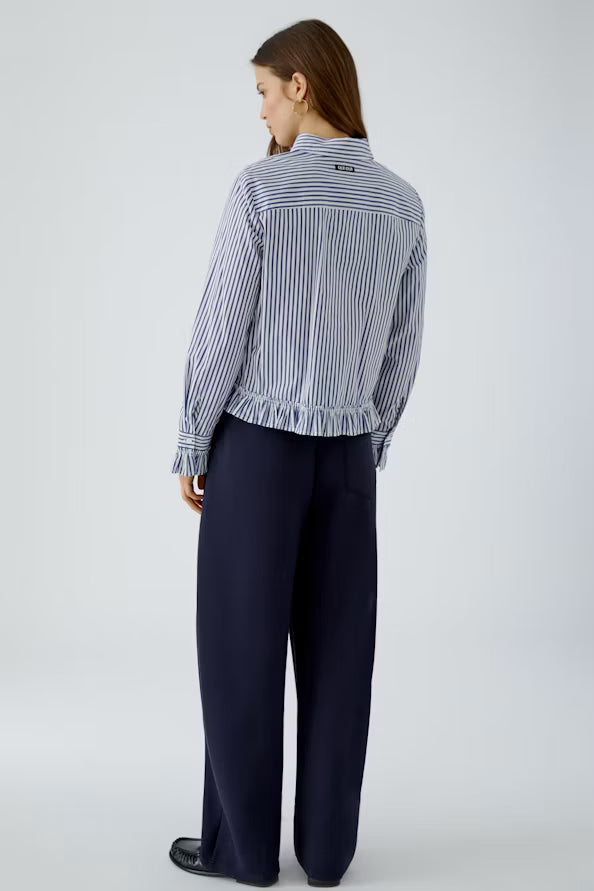 Striped blouse with attached ruffle on the sleeve and hem