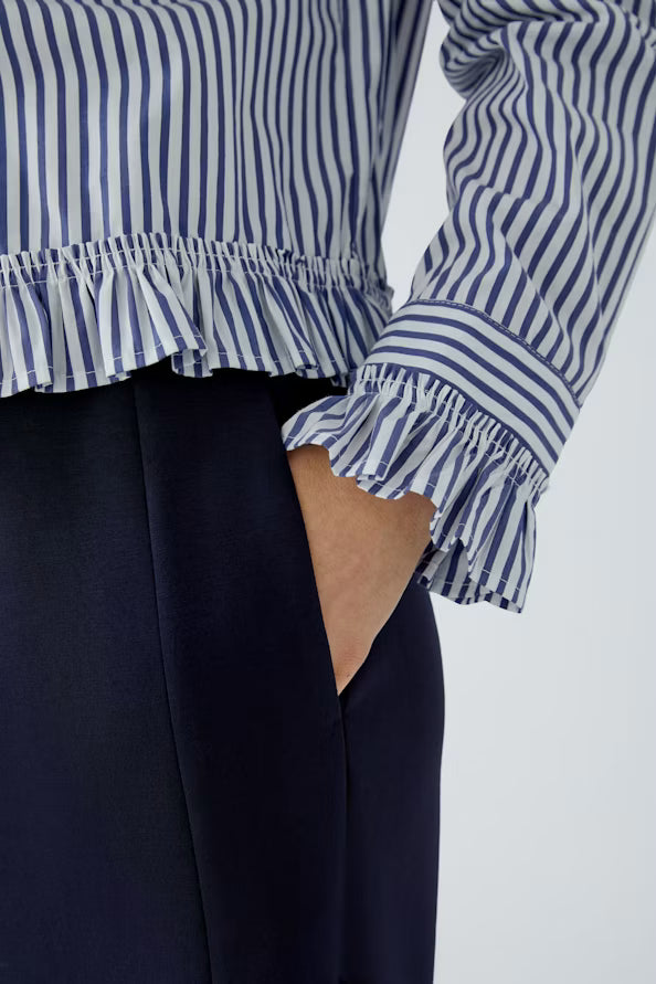 Striped blouse with attached ruffle on the sleeve and hem