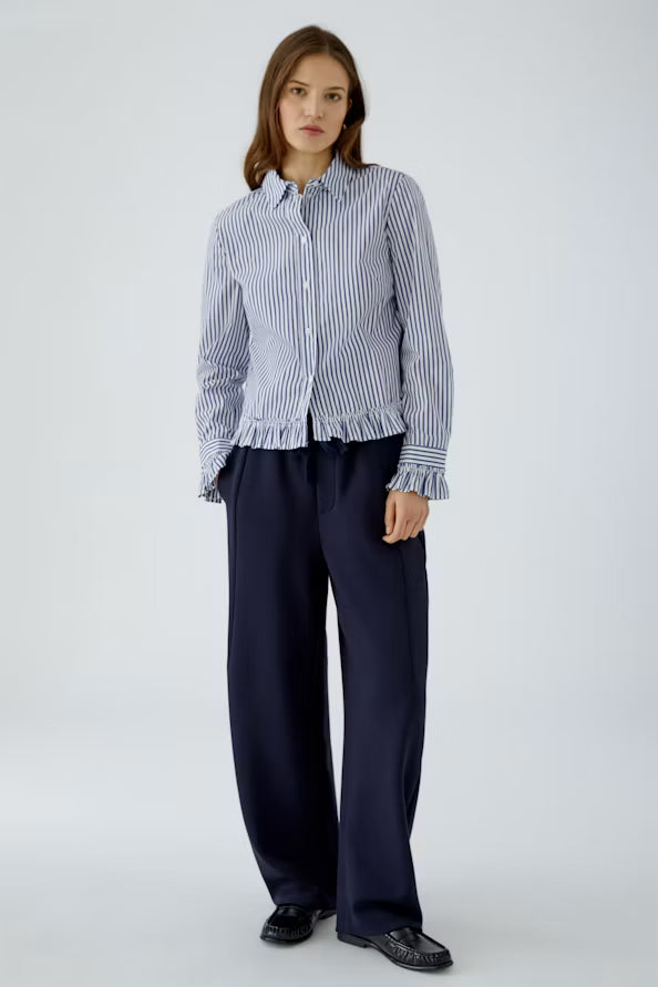 Striped blouse with attached ruffle on the sleeve and hem