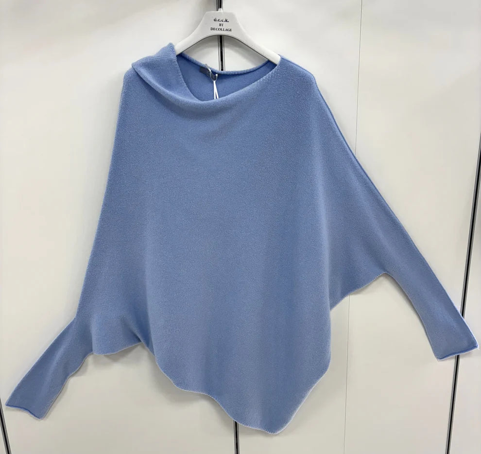 Blue poncho on a hanger against a white background