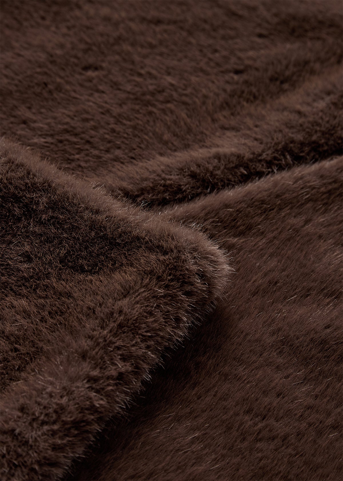 Close-up of brown fur fabric with a soft texture