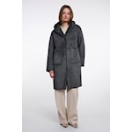 A woman modeling a dark gray mid-length coat with a high collar and front pockets, paired with light beige pants, against a plain light gray studio background.