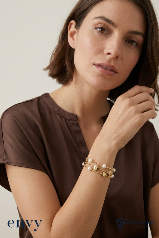  gold-tone flower and pearl-look bracelet worn with Via Appia Satin Look Bubble Hem Top