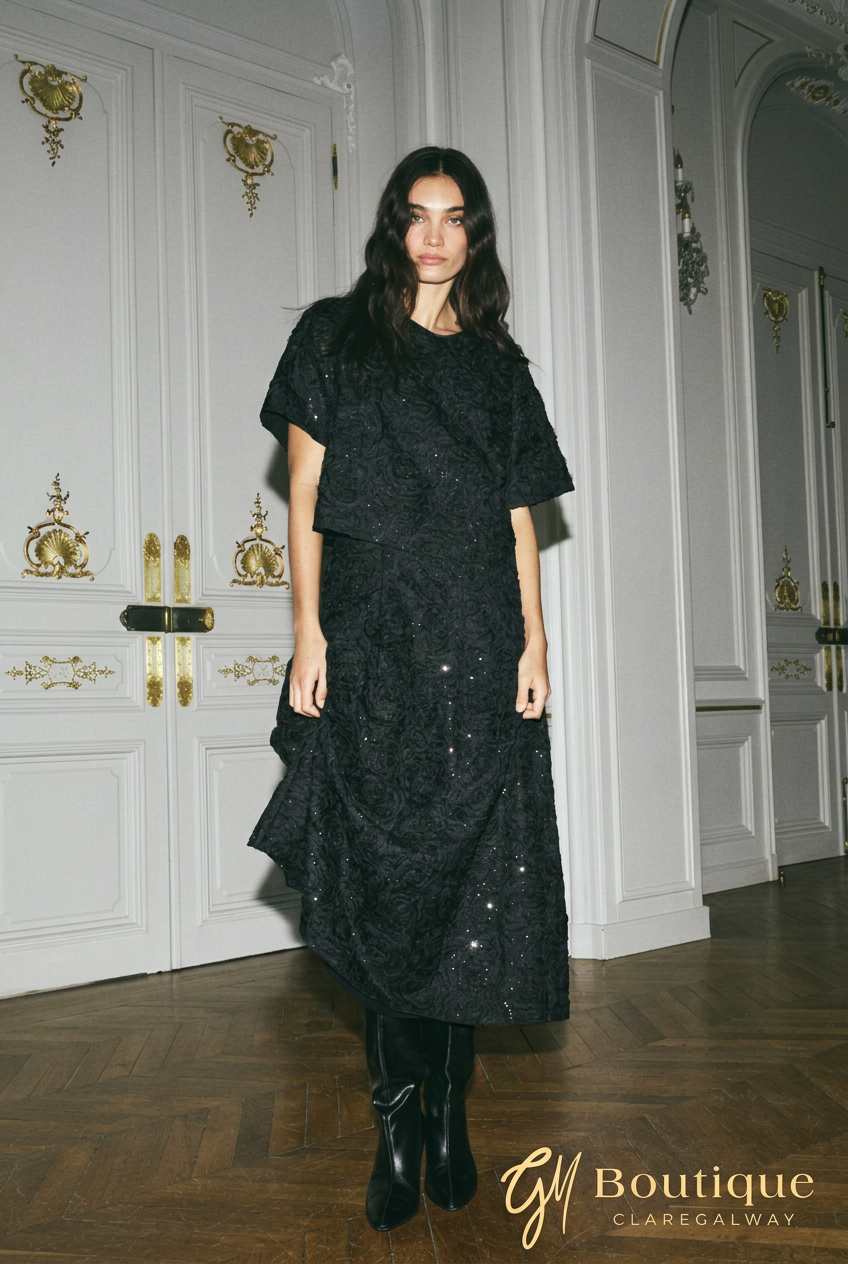 Front model view of Mos Mosh MMReya black sequin top styled with the matching midi skirt.