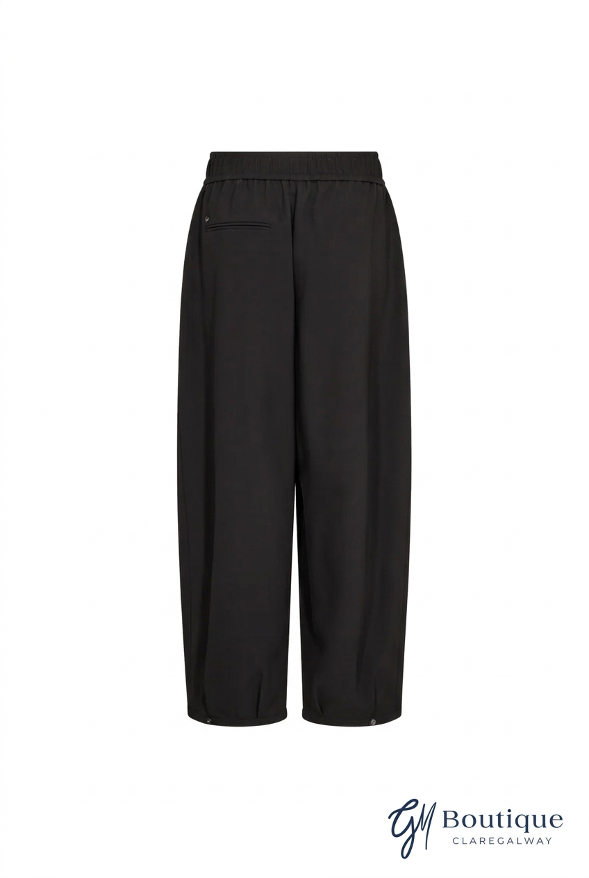 Black wide-leg cropped trousers with an elastic waistband and a side welt pocket, shown against a plain white background.