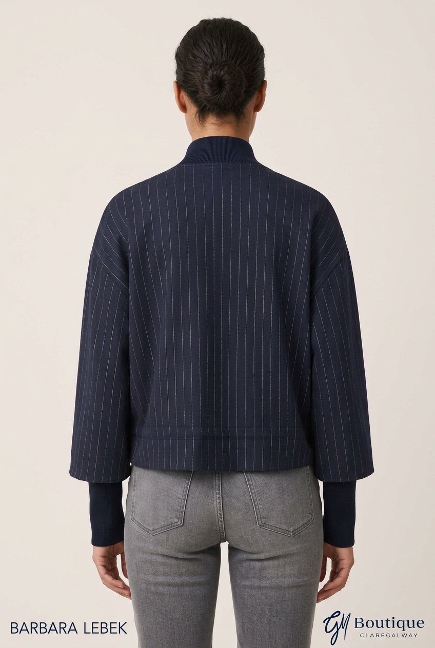 AI styling preview, rear view of Barbara Lebek navy pinstripe jacket with extended plain cuffs; Barbara Lebek and GM Boutique branding