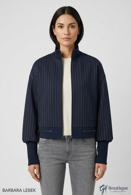 AI styling preview, front view of Barbara Lebek navy pinstripe zip jacket with stand collar and extended cuffs; Barbara Lebek and GM Boutique branding