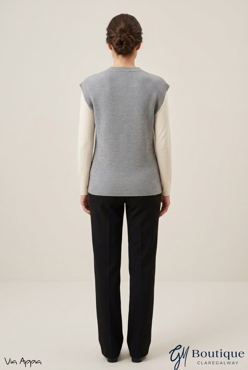 AI styling preview of Via Appia grey knitted waistcoat over a cream top, back view, with both logos