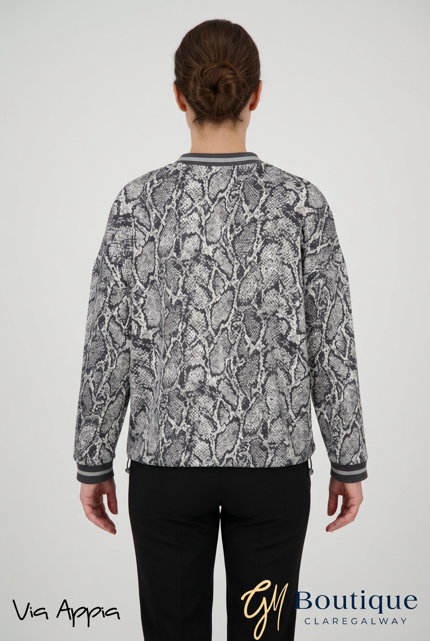 AI styling preview of Via Appia monochrome snake print jacket on a model, back view, with both logos